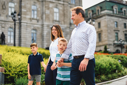 family having great time in city walking together