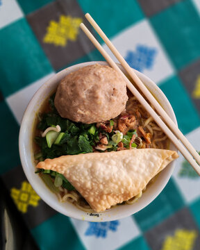 Bowl of Indonesian Bakso with Chopsticks and Fried Dumpling