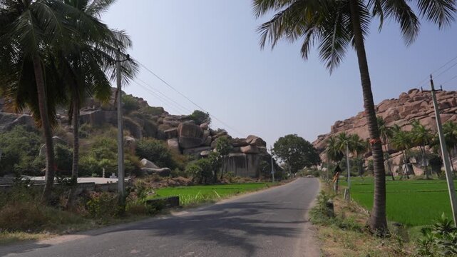 Scenic Road Amid Hills and Greenery in Hampi, Karnataka, India