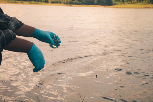 Environmental technicians conducting water sampling to support pollution control.