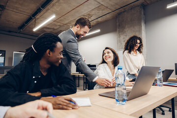 Fototapeta premium Diverse group of multinational men and women collaborating during office meeting