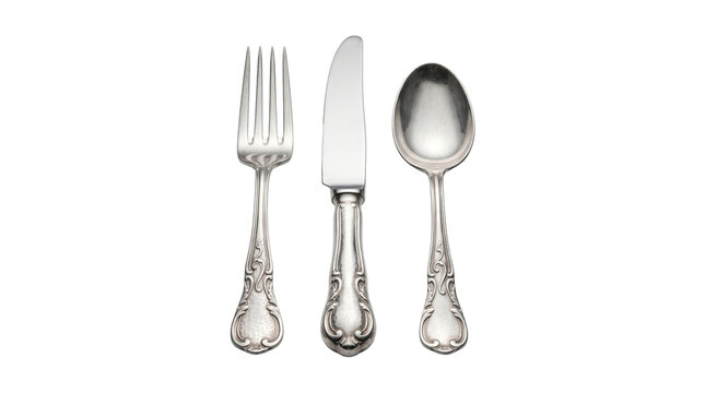 Antique silver cutlery set including fork knife and spoon with ornate vintage patterns on transparent background.