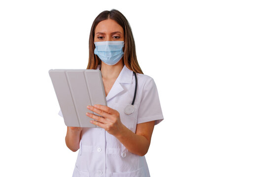 Young nurse wearing face mask and uniform, working with a tablet, symbolizing telehealth, online healthcare, and modern medicine