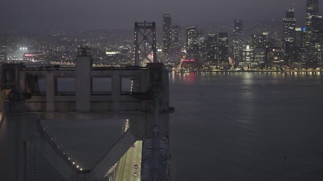 Bay Bridge West Span Traffic and San Francisco Skyline at Night - Aerial Shot