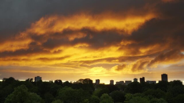 Dramatic Golden Sunset Over Edgbaston and Birmingham City Skyline.
A stunning wide shot capturing a dramatic sunset from a high vantage point in Edgbaston, Birmingham.