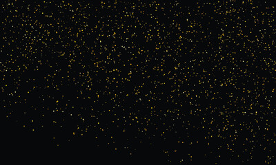 Fototapeta premium Golden glitter falling against a deep black background during a festive celebration