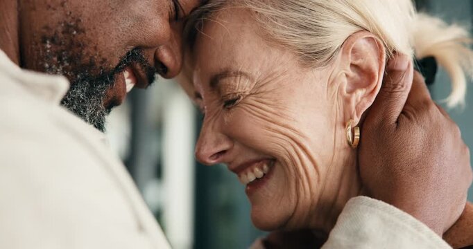 Happy, hug and couple with forehead touch in home with bonding, connection and love in marriage together. Interracial people, care and mature man with woman with support, trust and romance at house.