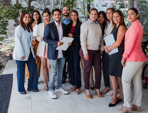 Latino business teamwork or diverse men and women working at office in Mexico Latin America. Portrait of hispanic big group of people employees in a company
