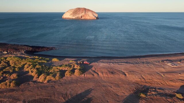 Experience camping at the beach on the Sea of Cortez during sunset with an suv and teardrop camper trailer in Baja California Mexico