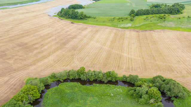 Aerial View of Meandering River and Farmland in Lithuania
