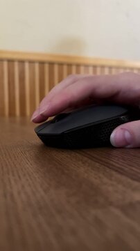 Close-up video of a female hand navigating with a laptop touchpad. Home office, remote work, business, internet, productivity and modern workplace