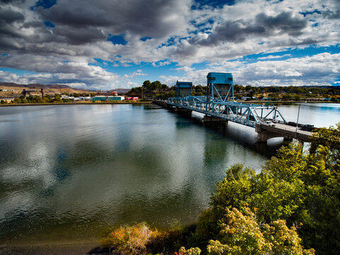 drone aerial photo of blue draw bridge connecting Lewiston ID and Clarkston WA over the Snake River