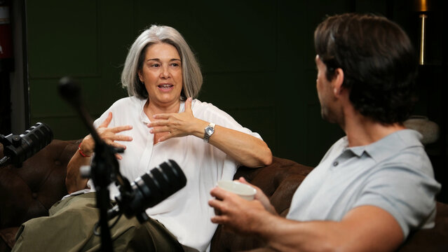 Woman talking passionately during an interview in a recording studio