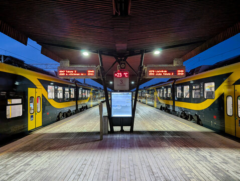 Riga Central Railway Station platform with modern electric passenger trains at late evening in Riga, Latvia. Selective focus