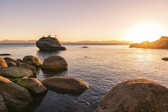 Bonsai Rock, small tree on a rock in the water, sunset, Lake Tahoe, California, USA