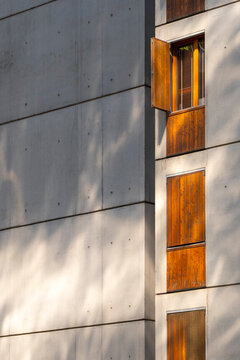 New residential development in La Confluence, Lyon, France appears through apartments architecture, where an urban building facade uses warm shutters across the district