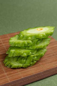 Bitter gourd on a green background