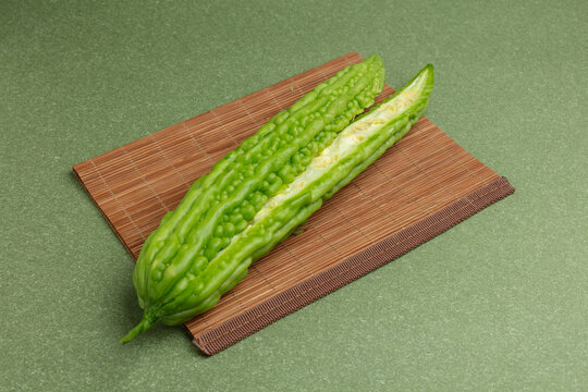 Bitter gourd on a green background
