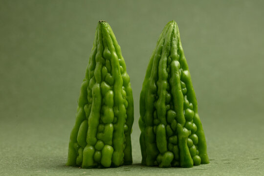Bitter gourd on a green background