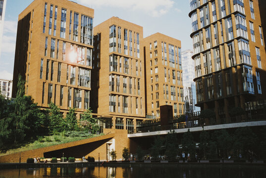 Modern apartment buildings cluster along a city waterfront
