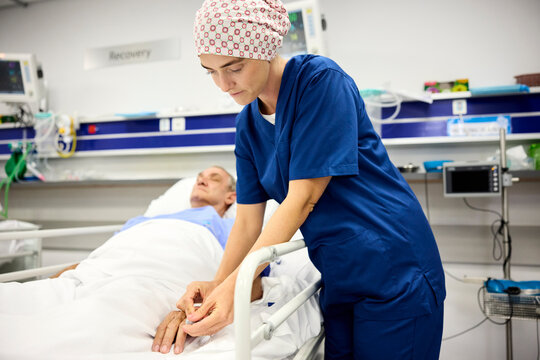 Doctor and Nurse Assist a Patient in Recovery