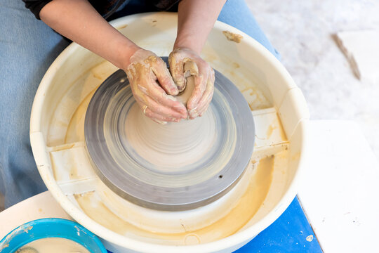 centering a lump of clay