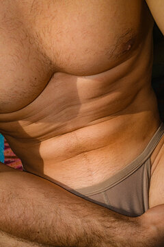 Male Body Form And Skin Sunbathing Relax Activity