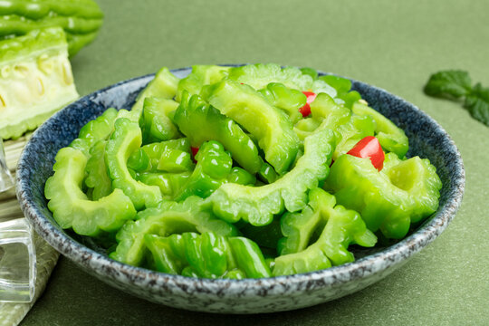 A plate of green stir fried bitter gourd
