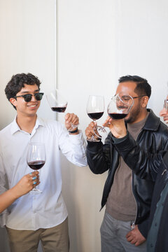 Group of friends cheers at a holiday Celebration 
