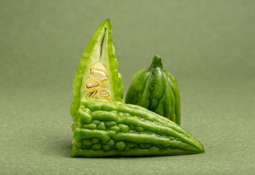 Bitter gourd on a green background