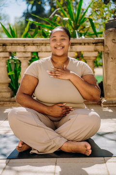 Portrait of a woman sitting in the lotus position