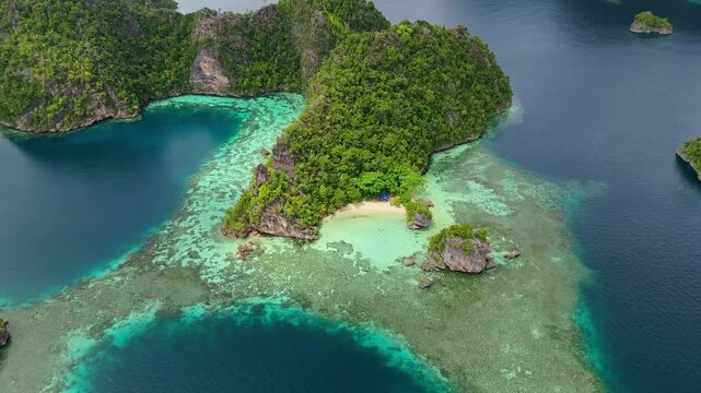 Breathtaking high angle panorama of untouched Misool coastline &ndash; Vivid turquoise water gradients, wild limestone islands and lonely beach sands, clean cinematic background asset for advertising