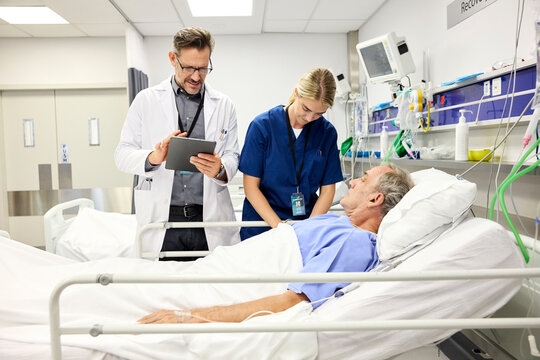 Doc Examines Patient With Nurse