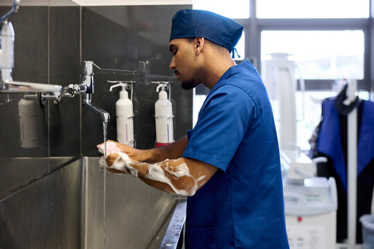 Doctor Washes Hands Before Patient Care