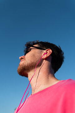 Man Listens to Music Outdoors