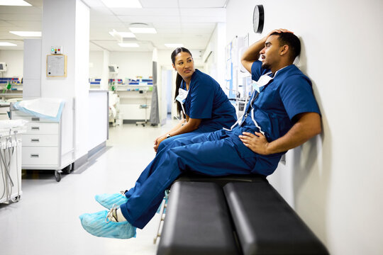 Doctors and Nurses Talk in Hospital Hallway
