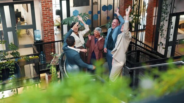 Creative office, team and people with hand stack, applause and success for remodeling contract. Collaboration, above and workers with solidarity, achievement and celebrate at interior design firm