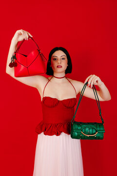 Woman with red and green handbags
