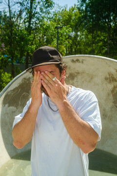 Skater Expressing Emotion During Practice at a Skate Park