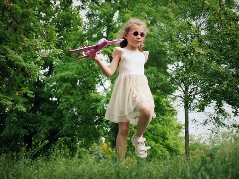 A girl with a model aeroplane