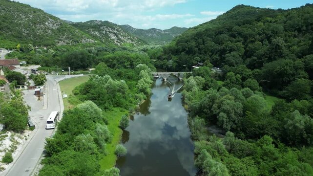 Drone view of Rijeka Crnojevica bridge and river in Montenegro