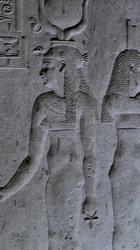 Dendera temple underground crypt corridors with hieroglyphic reliefs on walls in Egypt, narrow ancient passageways with carved inscriptions.