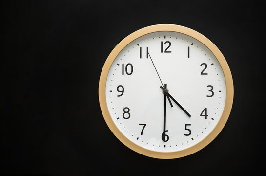 Wall clock showing four thirty. 16:30