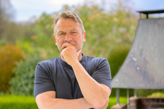 Thoughtful Man Reflecting Outdoors Seriously