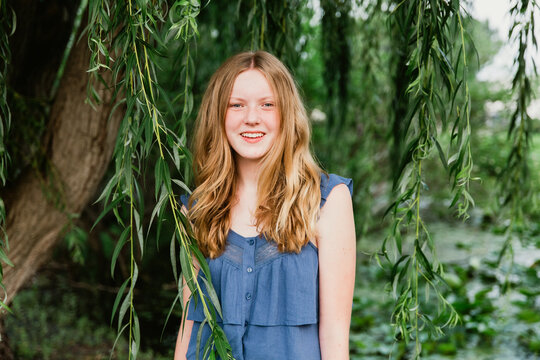 Portrait of a girl by a tree