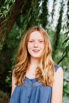 Portrait of a girl by a tree
