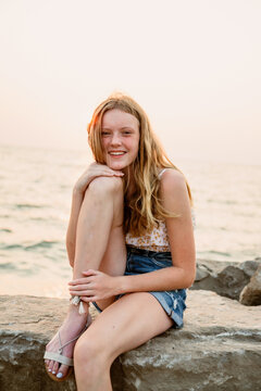 Portrait of a girl sitting on the shore