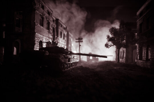 War Concept. Military silhouettes fighting scene on war fog sky background, World War Soldiers Silhouette Below Cloudy Skyline At night. Battle in ruined city.