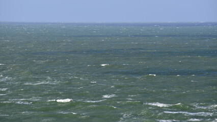 Moderate swell in the Atlantic Ocean, with some waves with white crests caused by the wind on a winter’s day. © Delfim Sa Neiva