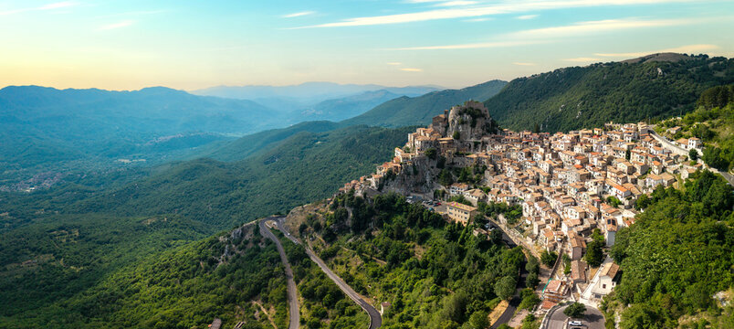 Cervara di Roma Aerial Drone Panorama 12K Wide Hilltop Medieval Village Near Rome Italy Stunning Sunset Golden Hour Light Authentic Historic Borgo Nestled Among Rolling Hills High Resolution 
